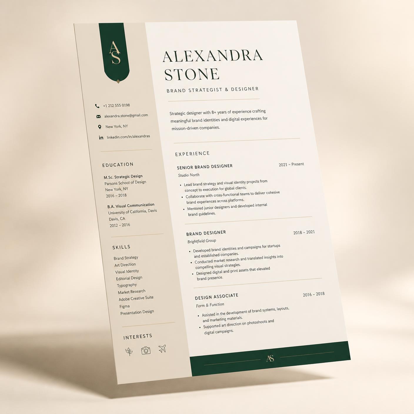 Editorial résumé design in cream and emerald